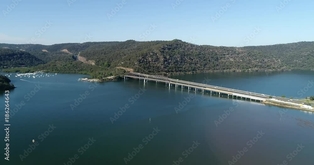 Hawkesbury river and Motorway M1 bridges on a sunny day in aerial flying forward view from East side.
Hawkesbury river and Motorway M1 bridges on a sunny day in aerial flying forward view from East side.