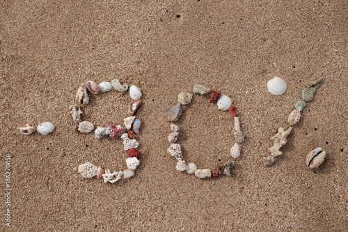 Text 90 percents on sand made from shell on seashore. Concept for big sales or black friday