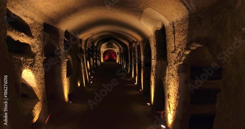 NAPLES, ITALY – JULY 2016 : Video shot in Catacombe di Napoli / Naples Catacombs with lights and carvings in view