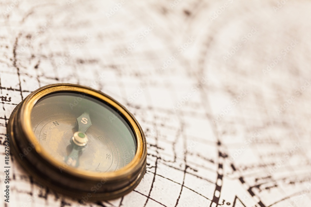 Closeup of an Old Compass on an Old Map Closeup of an Old Compass on an Old Map