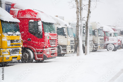 Trucks parking in severe winter storm. Prohibition of traffic in heavy snow
