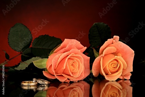 image of a bunch of Valentine Roses laying on beautiful table with rings