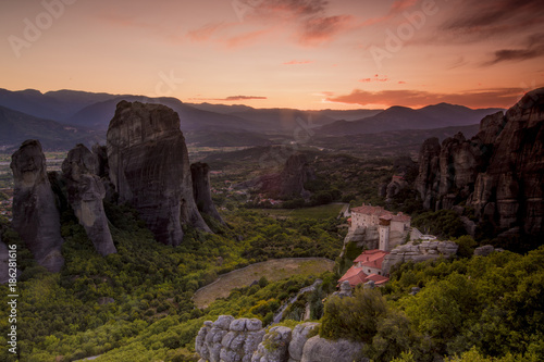 Amazing view of the Meteora site in Greece at sunset with one monestry