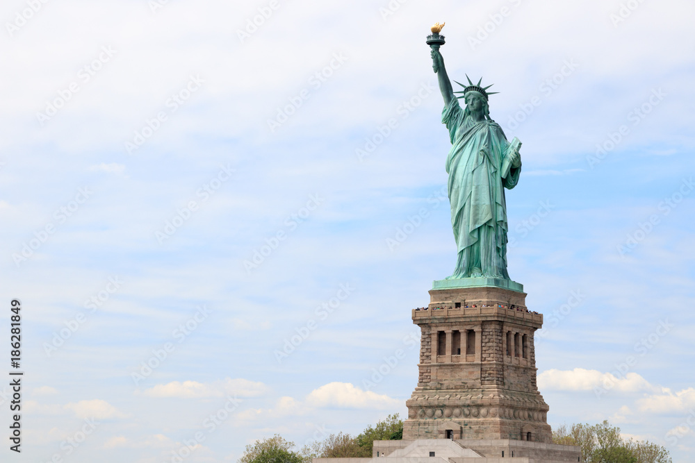 The Statue of Liberty on Liberty Island in New York City. This is the copper statue which is a gift from the people of France to the people of the United States. famous attraction in US.