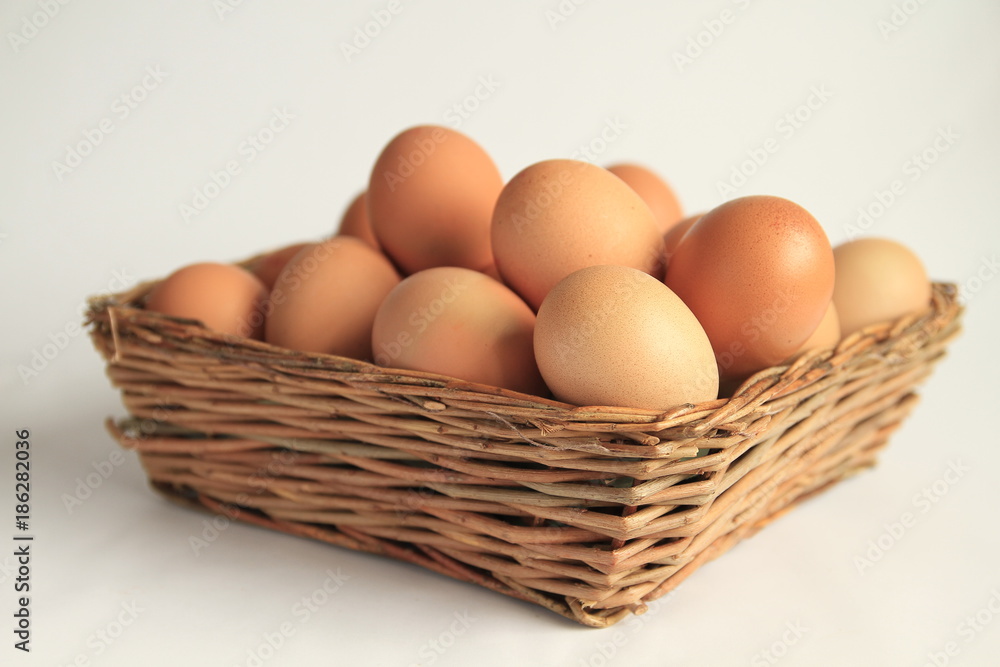 eggs in the basket on the table stock photo eggs in the basket on the table stock photo