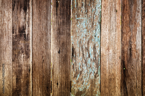 close up weathered old wood background with nail holes