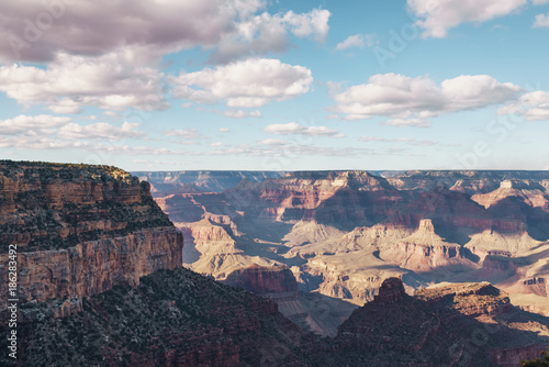 view from South Rim of Grand Canyon in sunny autumn day with white clouds