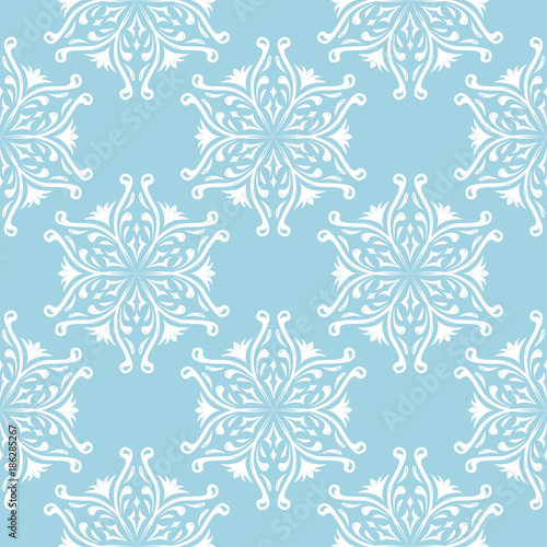 White flowers on blue background. Ornamental seamless pattern © Liudmyla