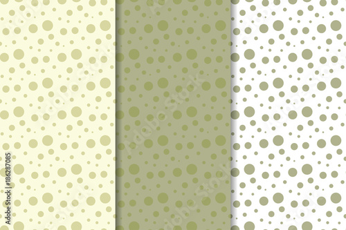 Olive green and white geometric ornaments. Set of seamless patterns