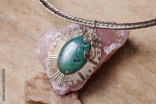 Beautiful gemstone necklace detail with natural background photo