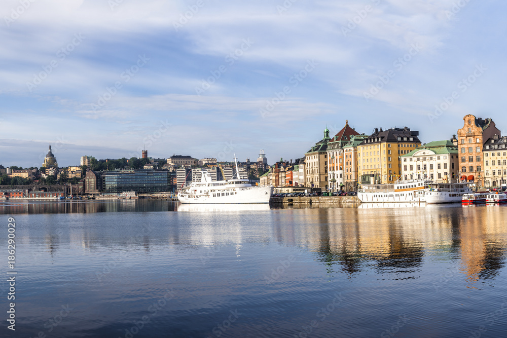 Stockholm daylight skyline panorama of Gamla Stan with white ships
