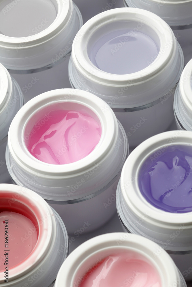jars with nail gel polish in different colors jars with nail gel polish in different colors