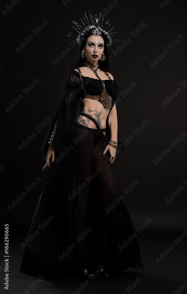 Woman in gothic suit and silver crown