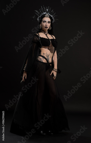 Woman in gothic suit and silver crown