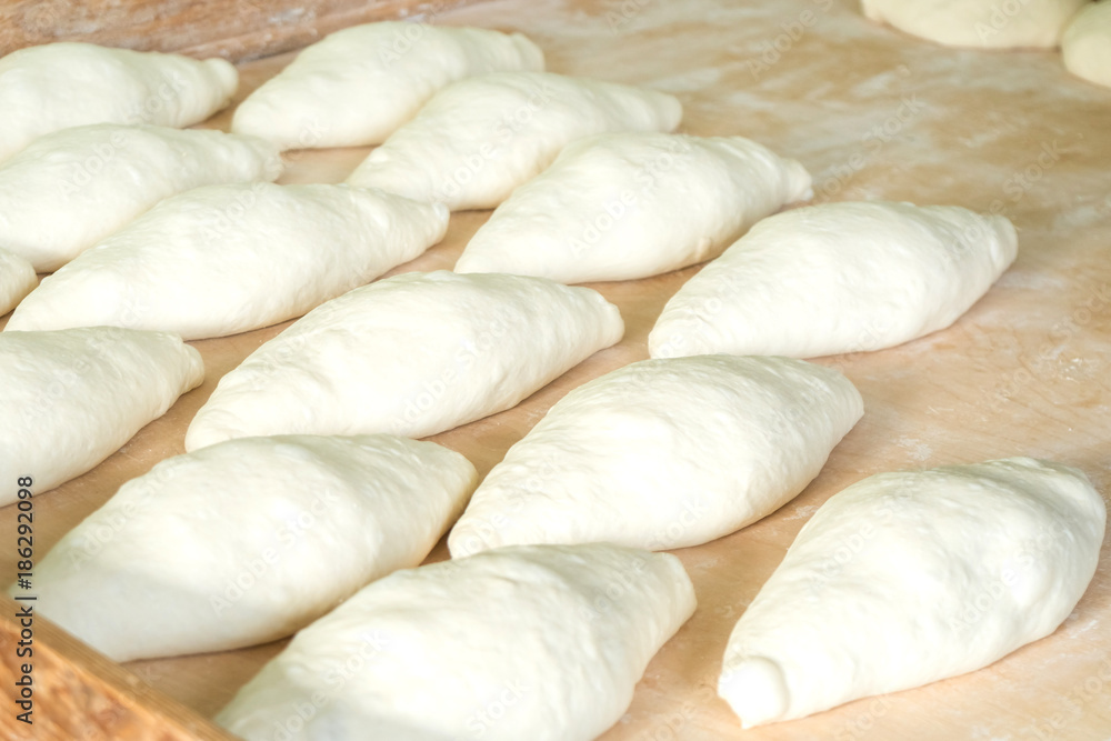 Fresh dough on the wooden board, pizza, Georgian bread Fresh dough on the wooden board, pizza, Georgian bread