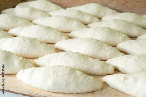Fresh dough on the wooden board, pizza, Georgian bread
