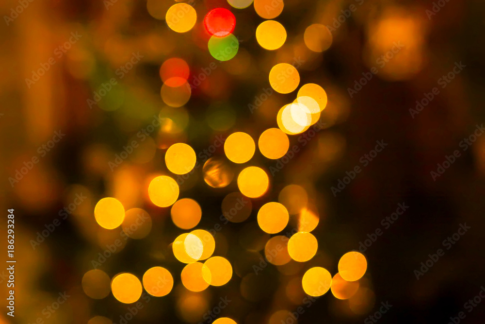Festive New Year background with blurred colorful lights.
