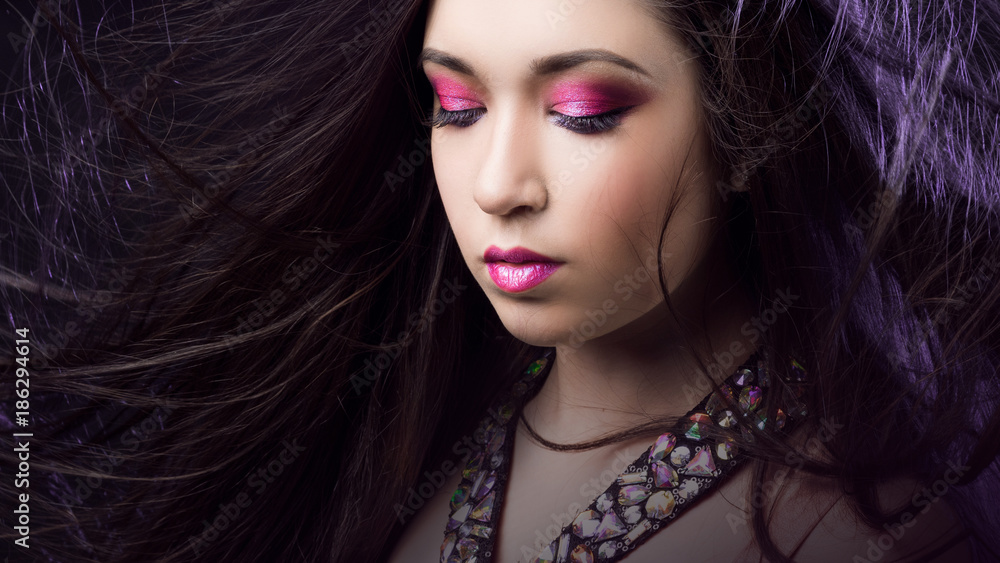 Portrait of young beautiful woman brunette with bright makeup Portrait of young beautiful woman brunette with bright makeup