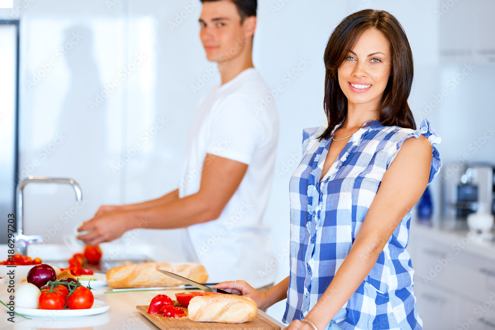 Couple cooking together at home Couple cooking together at home