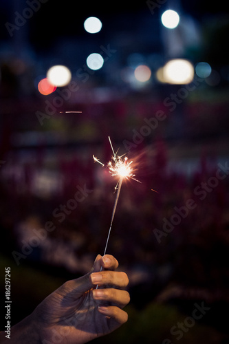 push firesparkler blink in hand up at night toning photo