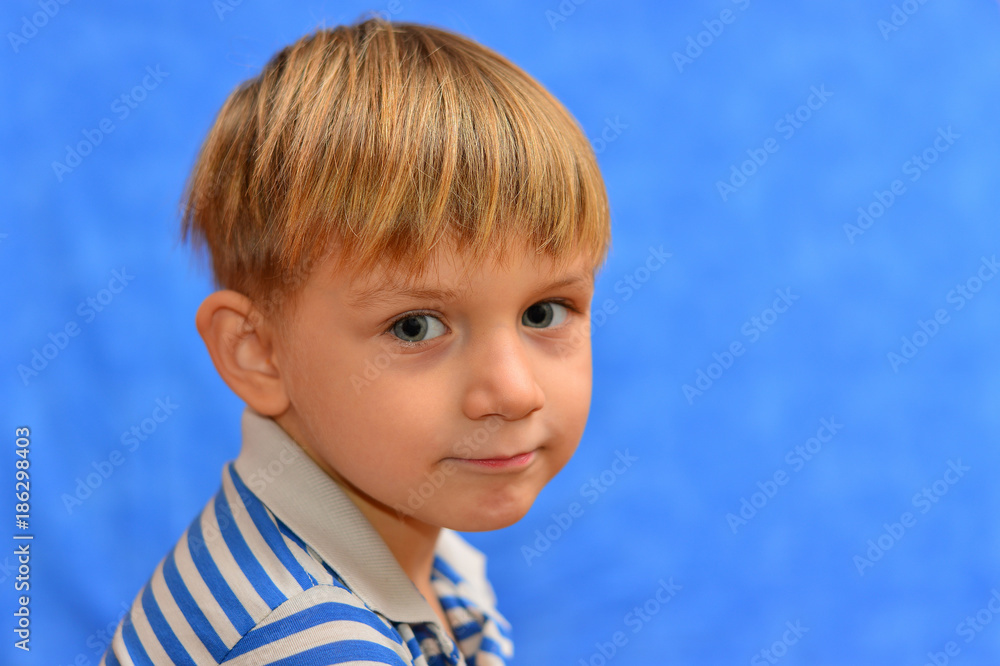 Portrait of a cute boy in a striped shirt. Studio shot, isolated on white background. Portrait of a cute boy in a striped shirt. Studio shot, isolated on white background.