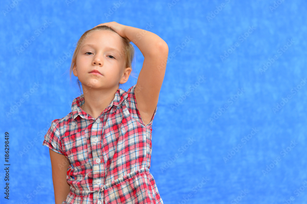 Studio shot of young preteen 9-10 year old redhead girl wearing heart shape sunglasses, standing against blue purple background, big thumbs up Studio shot of young preteen 9-10 year old redhead girl wearing heart shape sunglasses, standing against blue purple background, big thumbs up