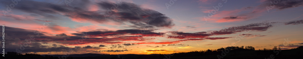 Landscape with colorful sunrise clouds panorama