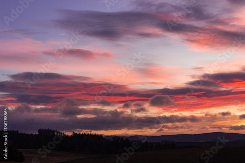 Landscape with colorful sunrise clouds