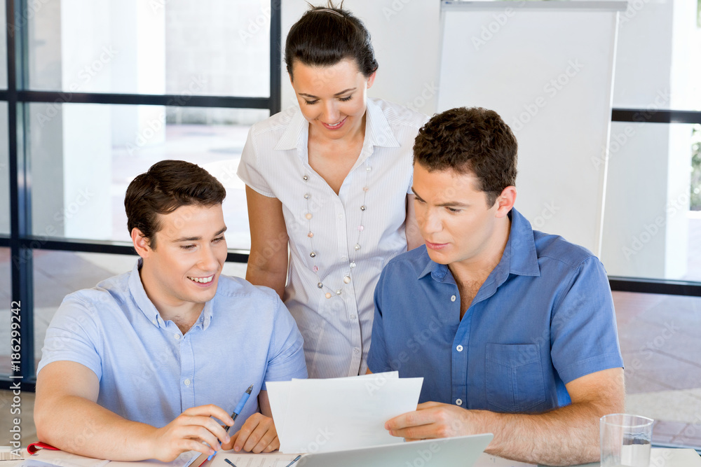 Group of happy young business people in a meeting Group of happy young business people in a meeting