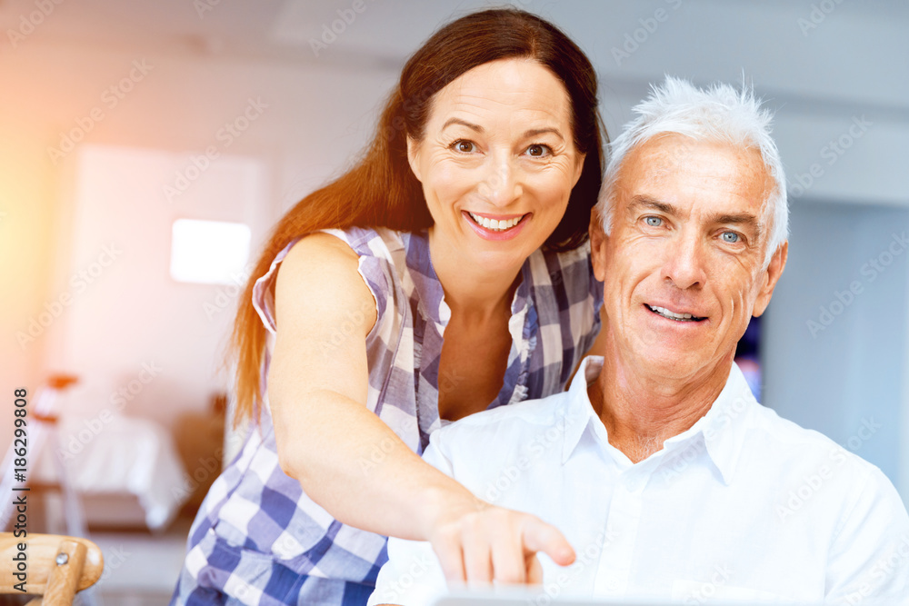 Mature couple looking at camera