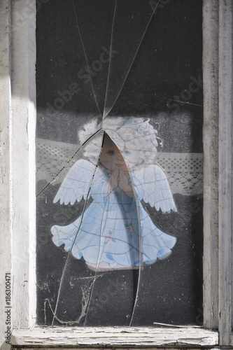 angel under broken glass photo