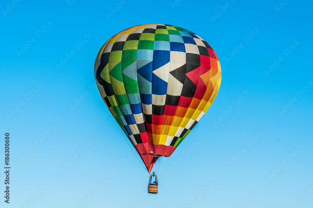 Obraz premium Rainbow Colored Hot Air Balloon