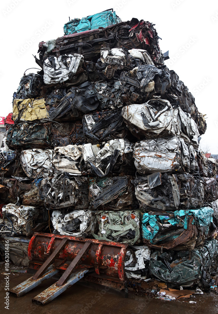 Junk yard with heap of metal waste Junk yard with heap of metal waste