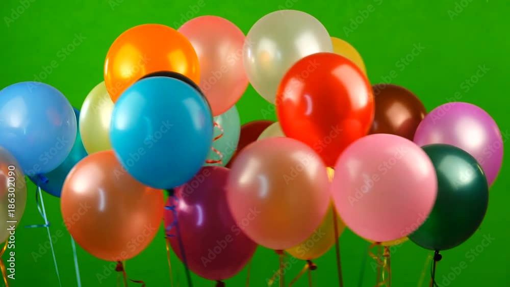 Flying balloons on green screen