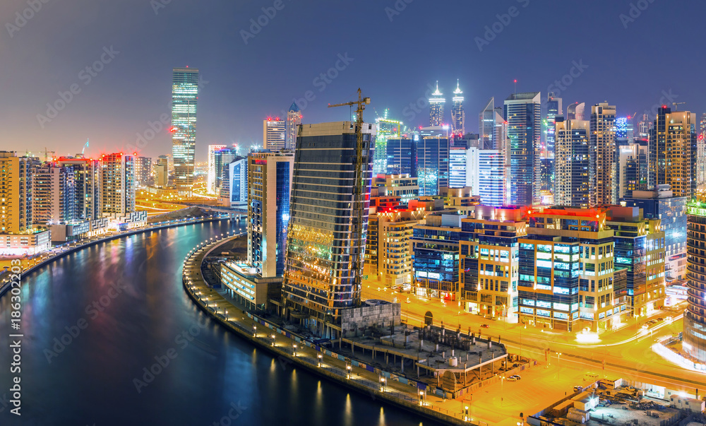 Dubai downtown and water canal with promenade after the sunset,Dubai,United Arab Emirates Dubai downtown and water canal with promenade after the sunset,Dubai,United Arab Emirates