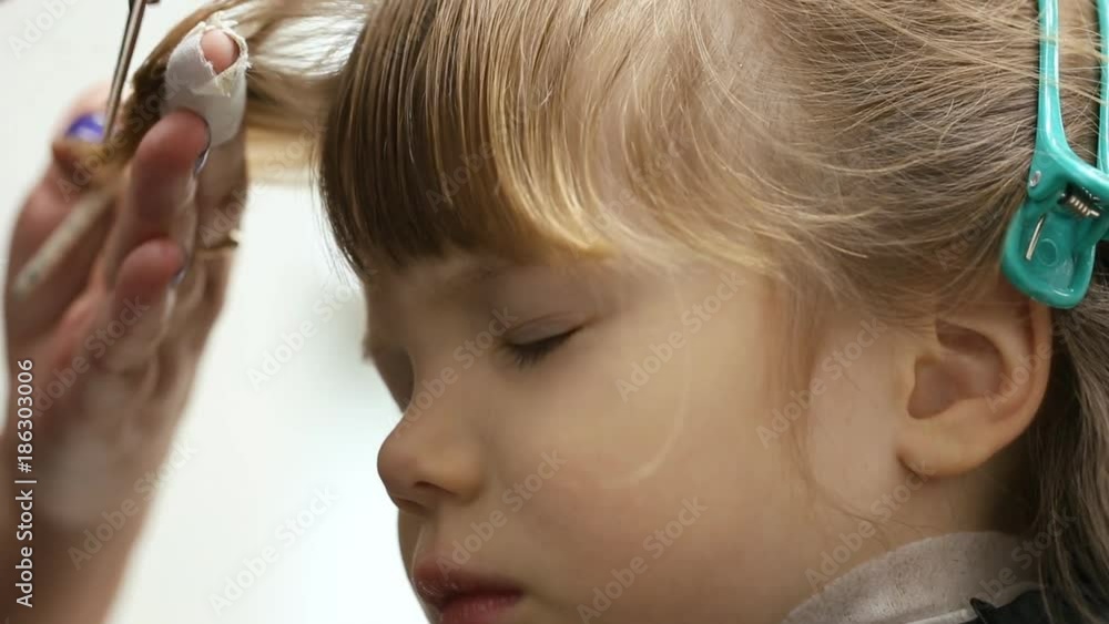 Small girl at hairdressing saloon Small girl at hairdressing saloon
