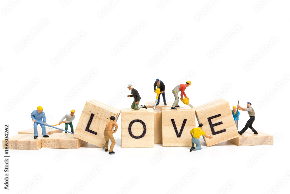 Miniature people : Worker team building word Miniature people : Worker team building word