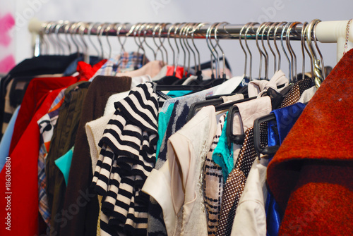 Clothes hang on a shelf on a yardsale sale