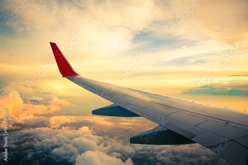 Morning sunrise with Wing of an airplane. Photo applied to tourism operators. picture for add text message or frame website. Traveling concept