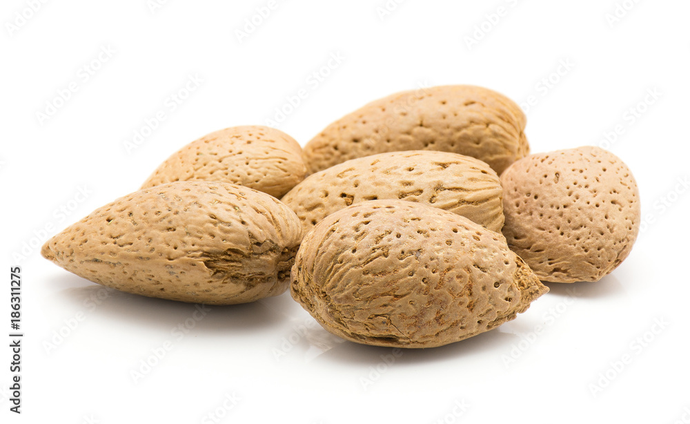 Unshelled almonds stack isolated on white background. Unshelled almonds stack isolated on white background.