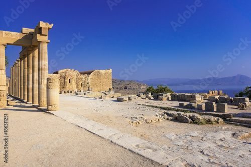 Columns of Portico and Church of St. John on the Acropolis of Lindos (Rhodes, Greece) photo