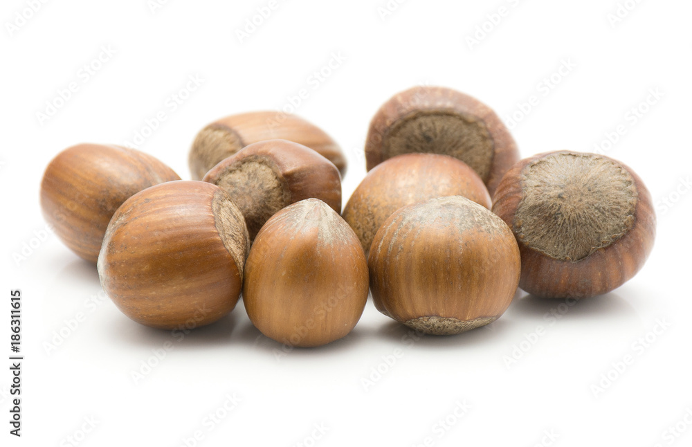 Hazelnuts unshelled stack isolated on white background. Hazelnuts unshelled stack isolated on white background.