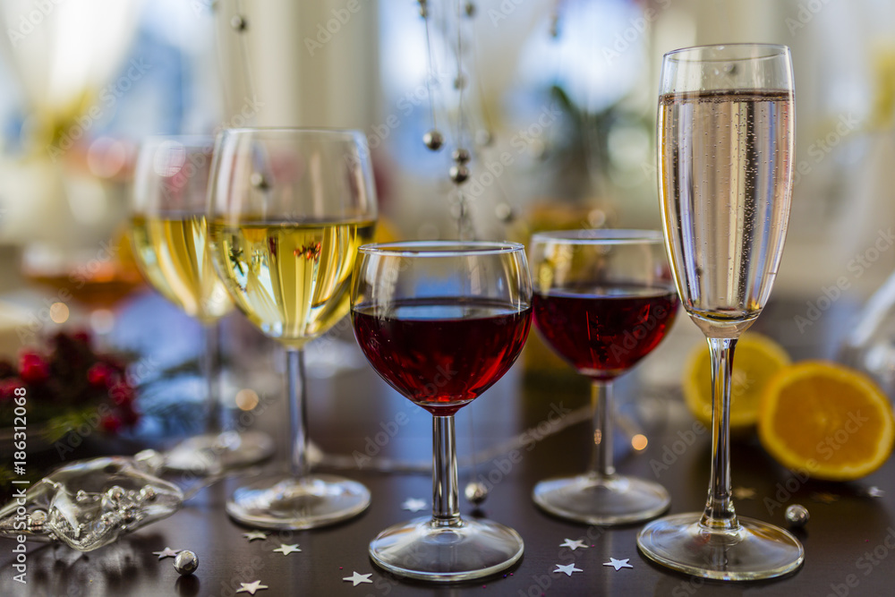 New Year's party. White and red wins and drinks in glasses.
New Year's party. White and red wins and drinks in glasses.
