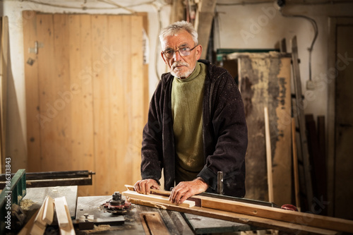 Senior man working with wood