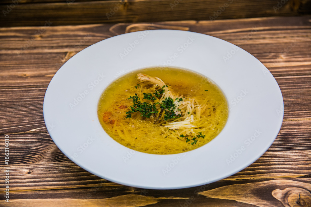 Food on a plate, on a wooden background.Food detail Food on a plate, on a wooden background.Food detail
