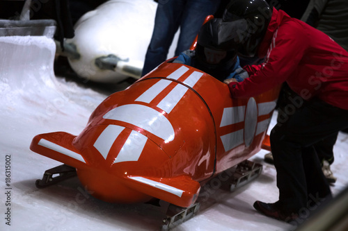 a red bob sled on the start