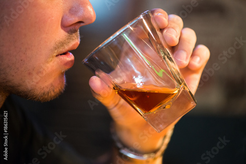 Man drinking scotch whiskey