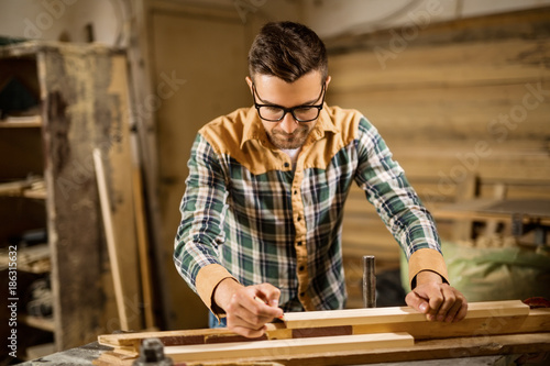 Young carpenter in a workshop