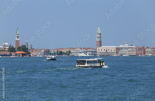 cityscape View of the island of VENICE in Italy with the ancient palaces and bell towers from the ferry boat called Vaporetto in italian language