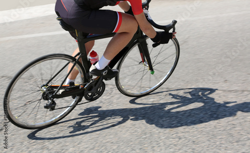 cyclist over a black bike during the curve